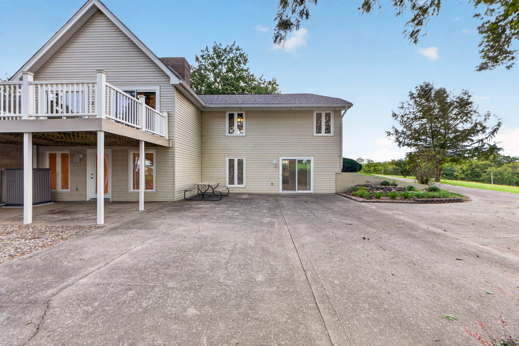 Rear of the home with deck