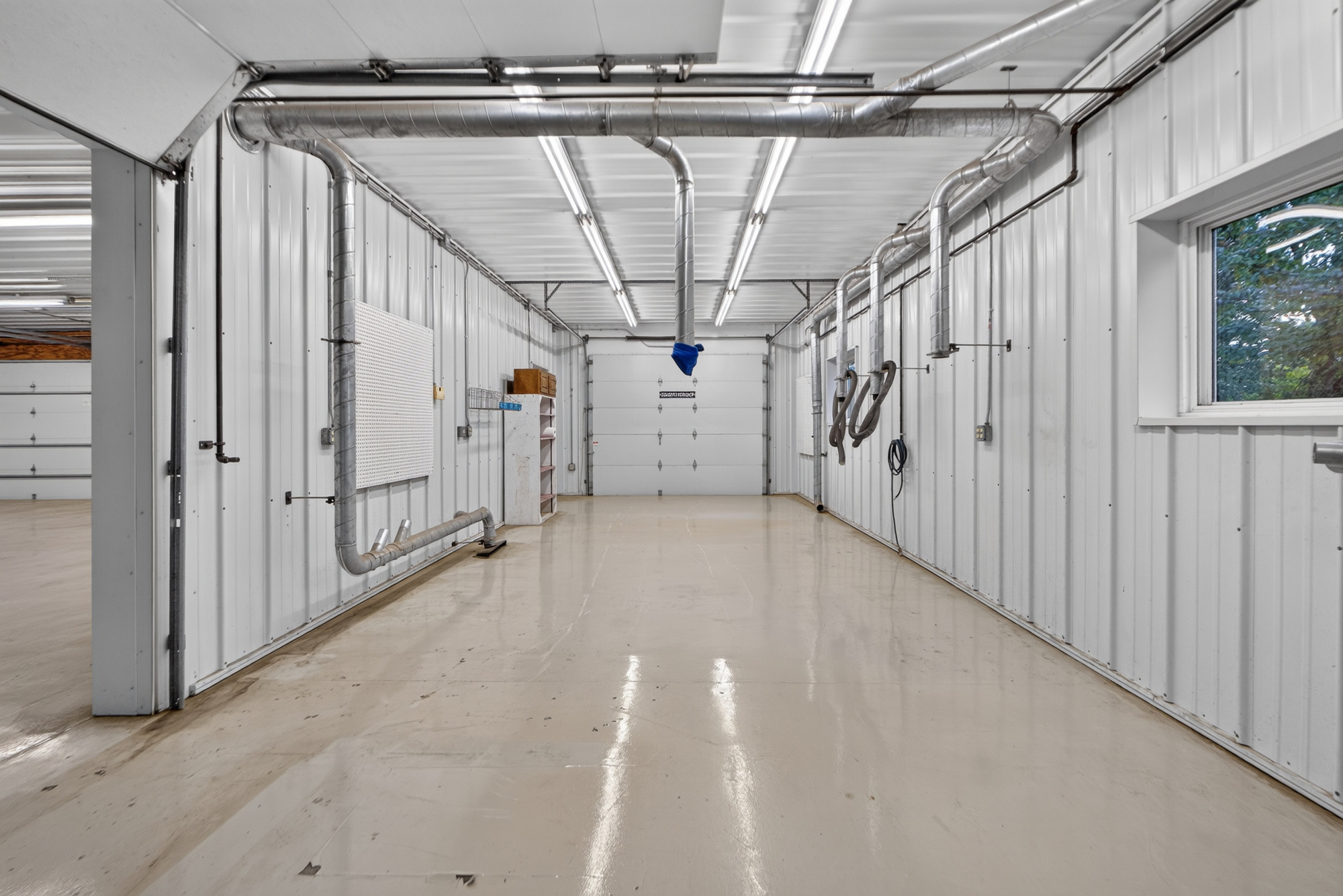 Workshop with overhead air lines and concrete floors